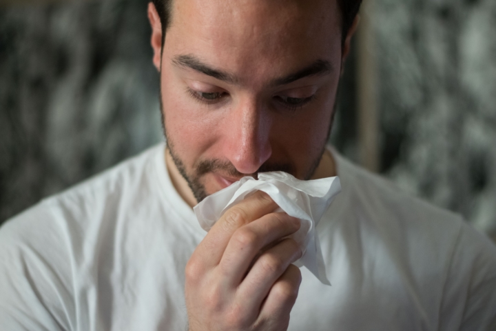 man with tissue