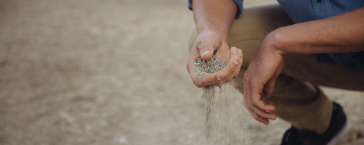 man holding sand