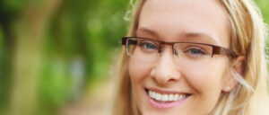 woman in glasses smiling