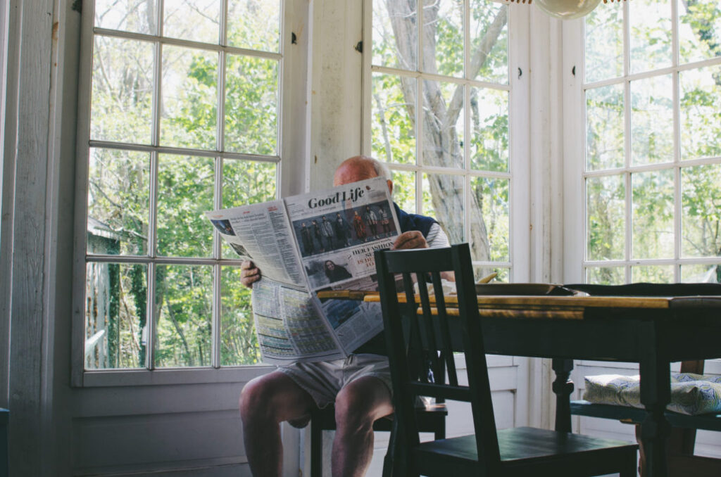 man reading newspaper