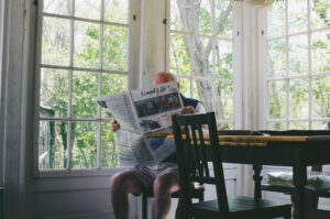 man reading newspaper