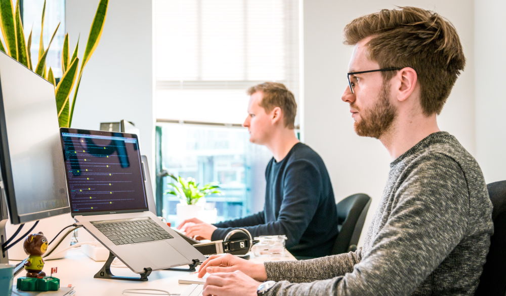 men at work on computers