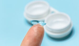 contact lens on fingertip