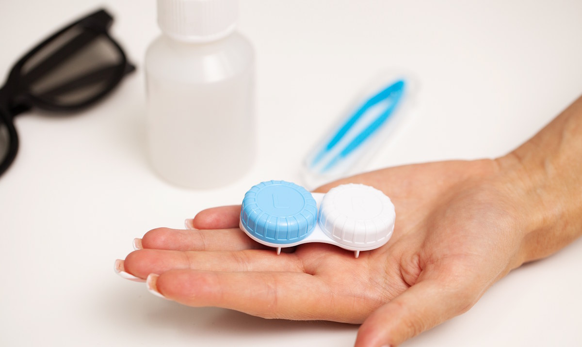 holding contact lenses in hand