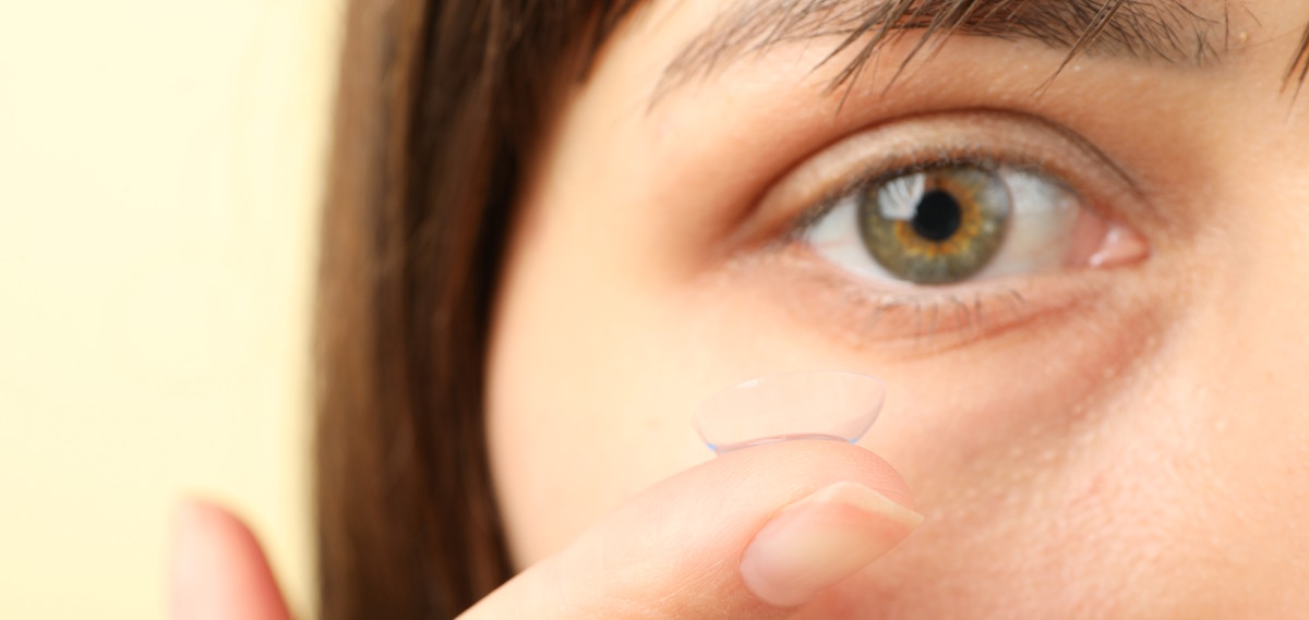 holding contact lens up to eye