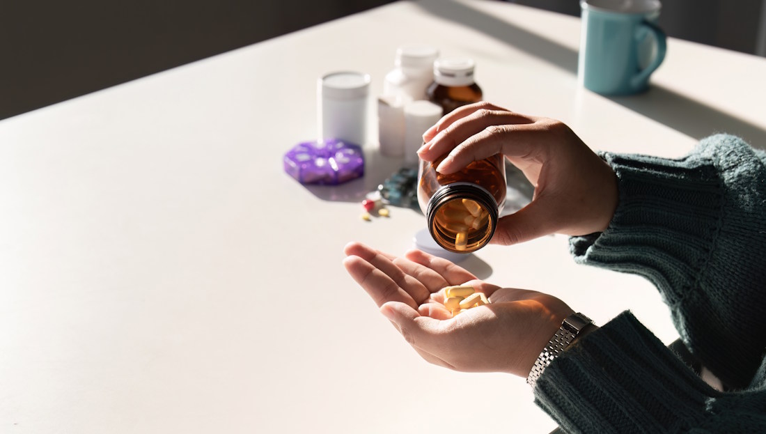 dumping medications in hand