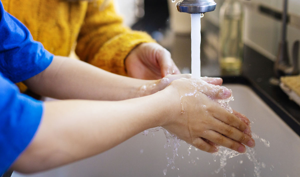washing hands in the sink