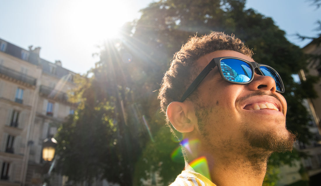 looking into the sky with sunglasses