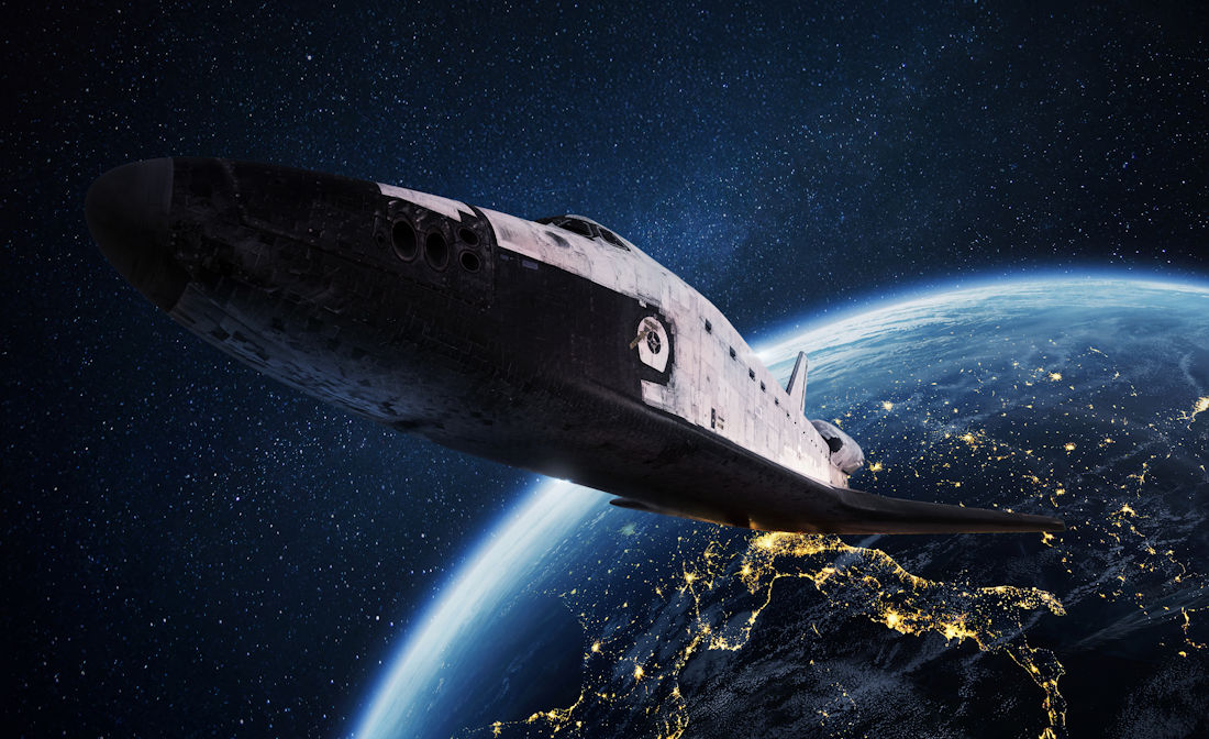 space shuttle above Earth