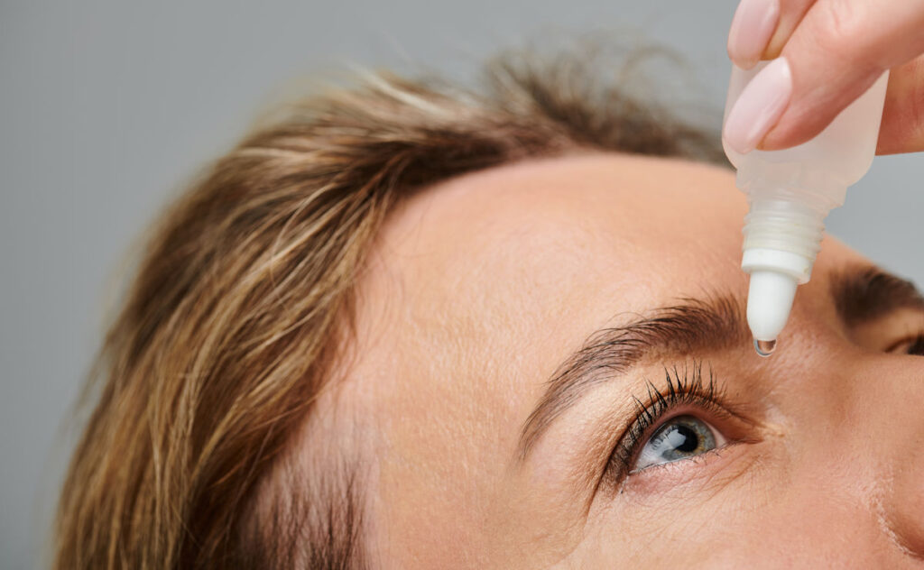 applying eye drops