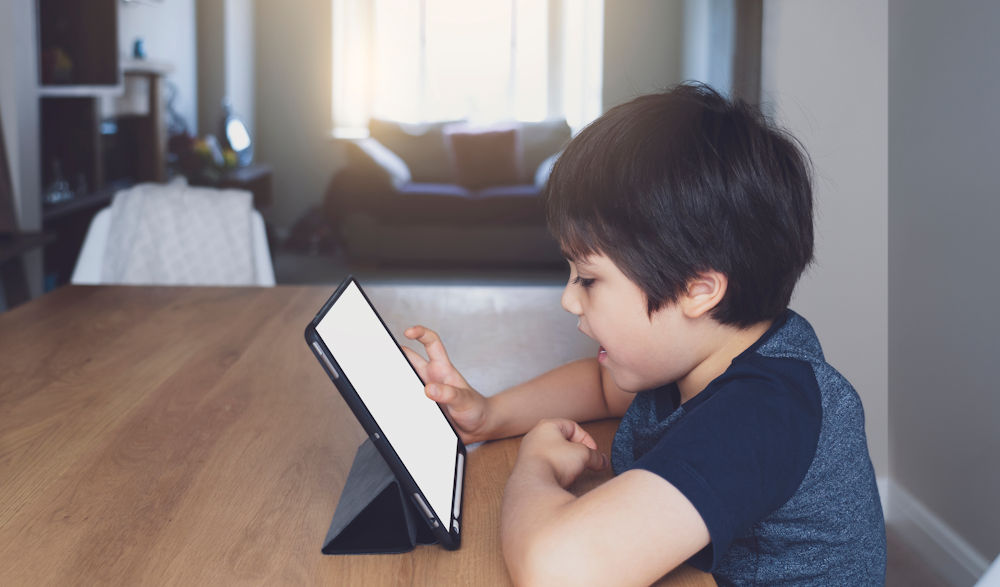 kid using tablet